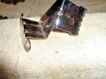 Timing Chain Cover Tab, Nos Gm 39911435 With "mw" Stamp. 76-91 305, 350 Motors New. Price: $8.80.